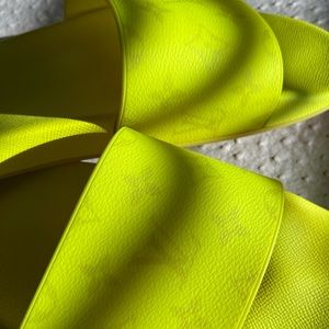 Louis Vuitton Neon Yellow Monogram
Rubber Waterfront Flat Slides